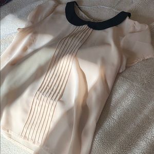 White blouse with black collar